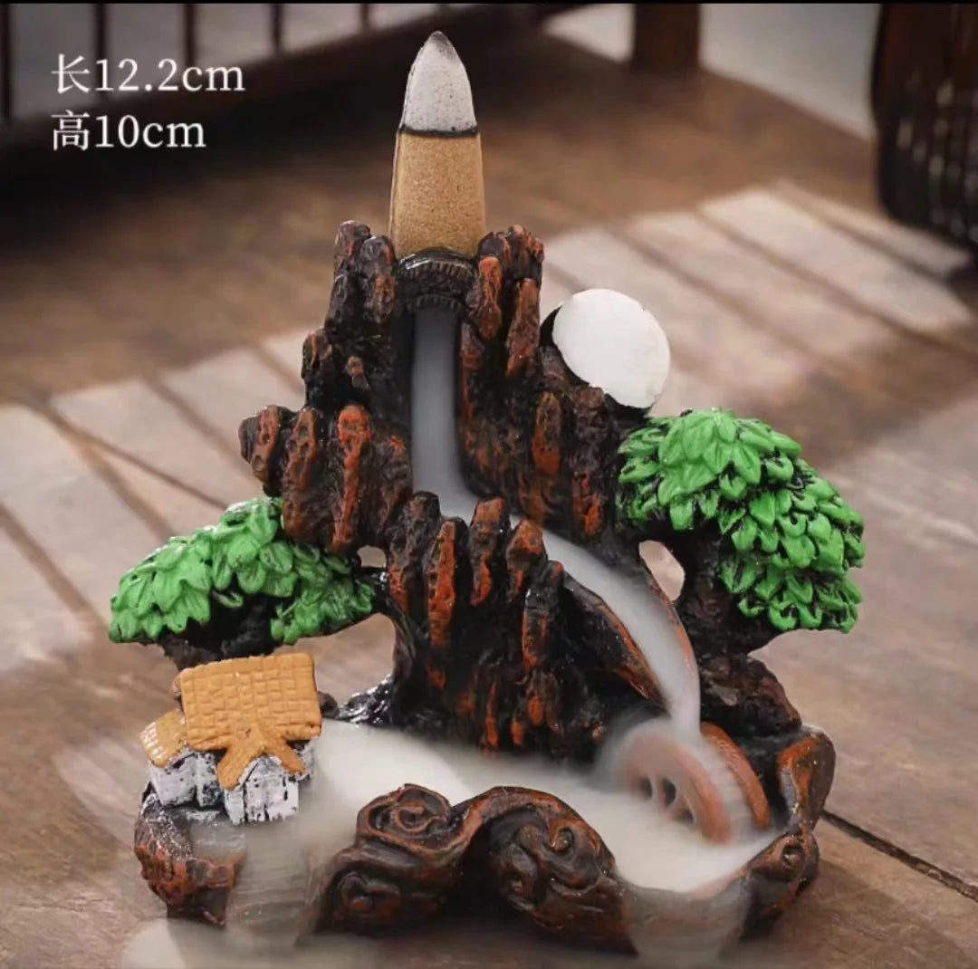 Dreamy High Peak Waterfall Incense Burner – Hand-finished resin sculpture designed for backflow cones. Watch in awe as scented smoke flows downward like morning mist over towering mountains—pure tranquility and visual poetry