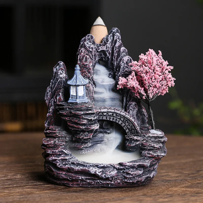 Dreamy High Peak Waterfall Incense Burner – Hand-finished resin sculpture designed for backflow cones. Watch in awe as scented smoke flows downward like morning mist over towering mountains—pure tranquility and visual poetry